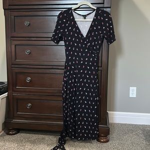 Black wrap dress with flowers.
